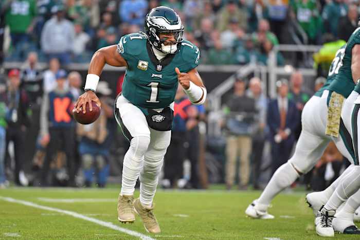 Philadelphia Eagles quarterback Jalen Hurts runs with the ball against the Dallas Cowboys.